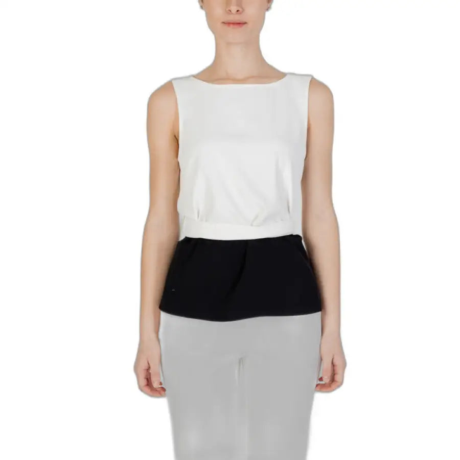 
                      
                        Sandro Ferrone Sandro Ferrone women top featuring woman in white top and black skirt
                      
                    