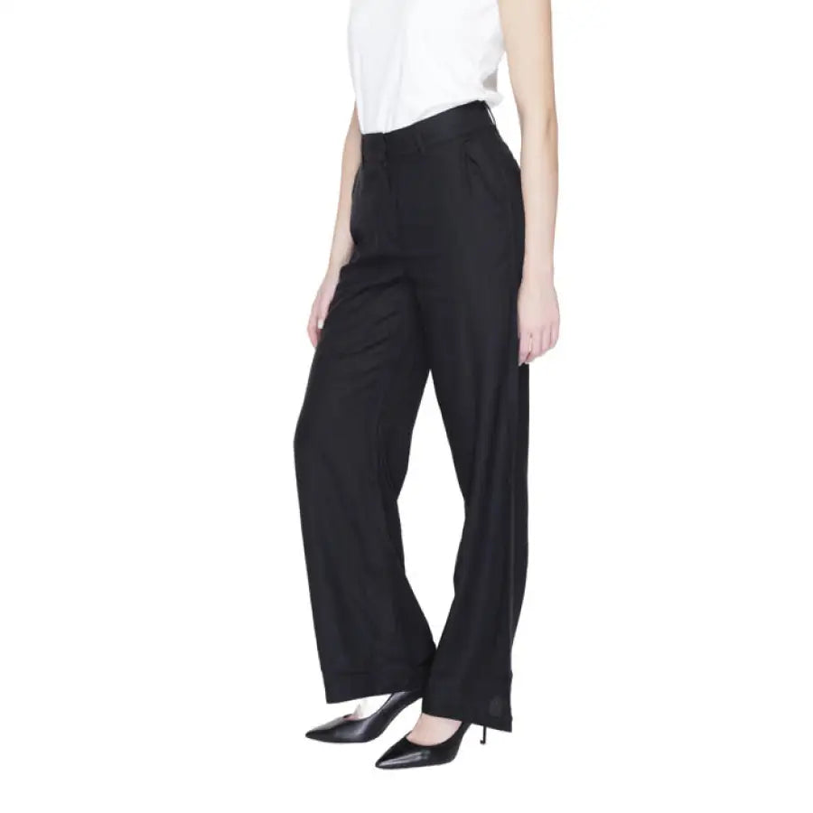 Vero Moda urban style clothing - woman in white top and black trousers