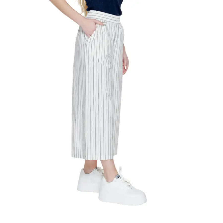Vero Moda woman in urban style clothing, black and white striped skirt