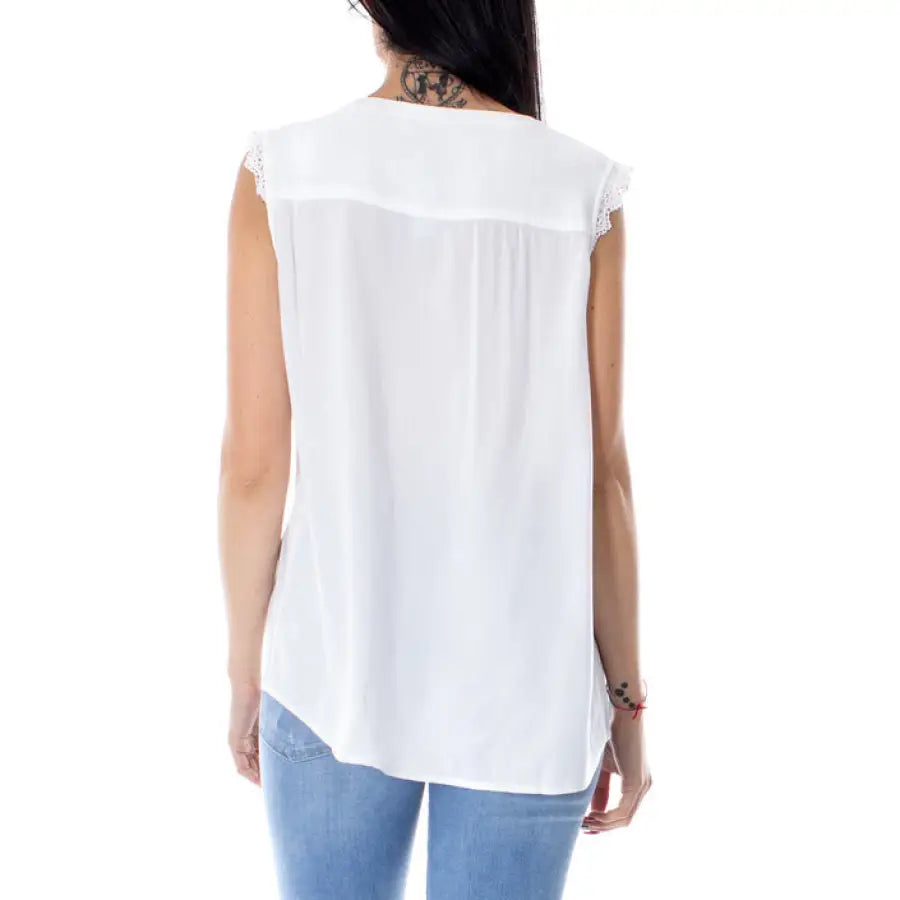 
                      
                        Woman in white blouse with back tie - Only Women Top, urban city style clothing
                      
                    