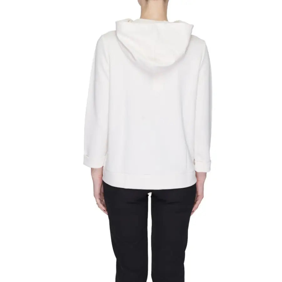 
                      
                        Woman in white hoodie showcasing urban city style fashion
                      
                    