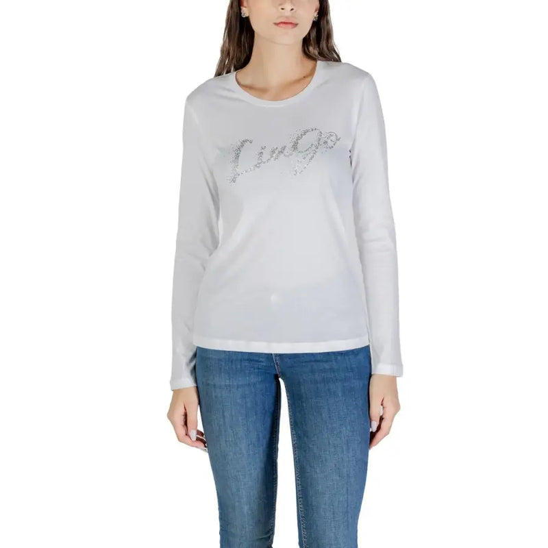 Woman wearing Liu Jo white long sleeve cotton T shirt with sparkly Liù Jo graphic