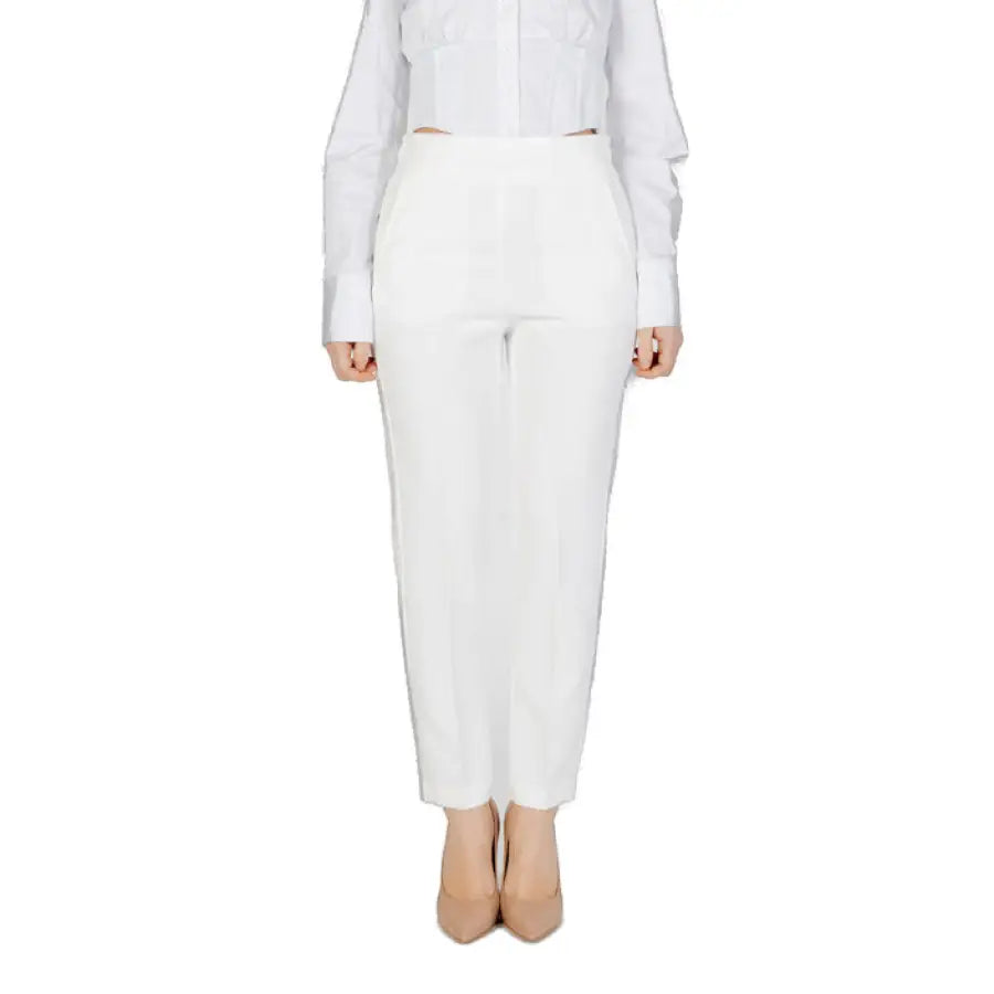 Woman wearing Sandro Ferrone white trousers