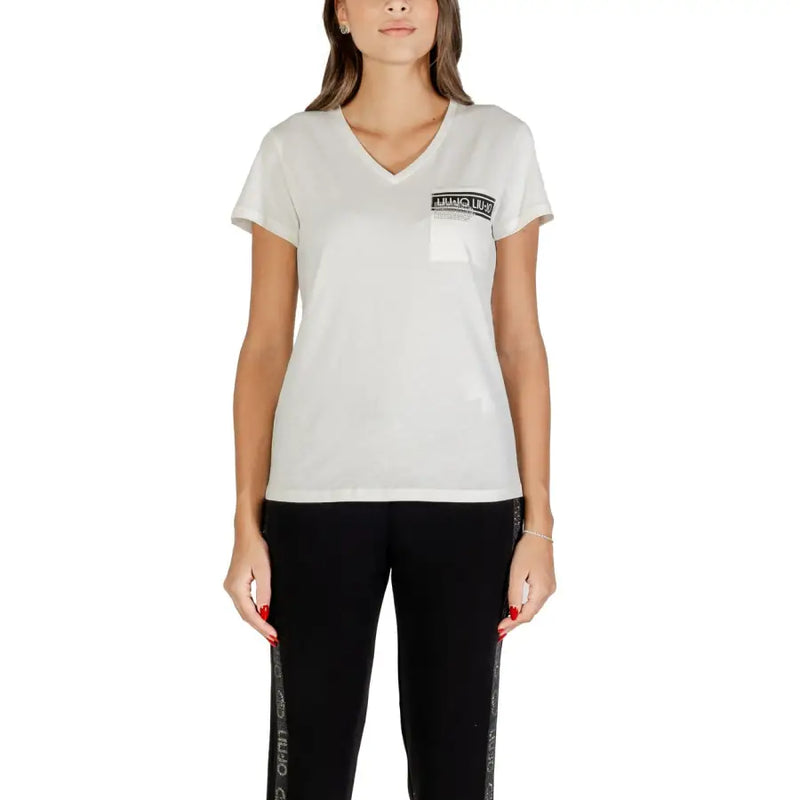 Woman wearing Liu Jo White V Neck Cotton T Shirt with Pocket and black leggings with side stripes