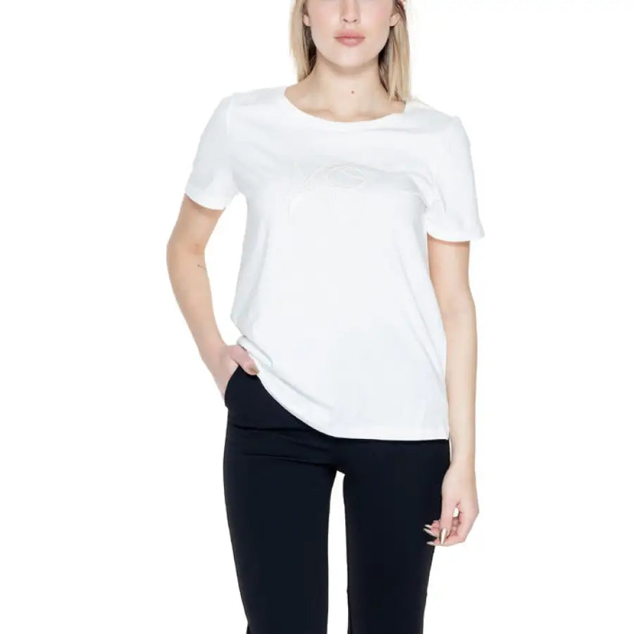 
                      
                        Woman in Street One T-Shirt showcasing urban city style with white short sleeve top
                      
                    