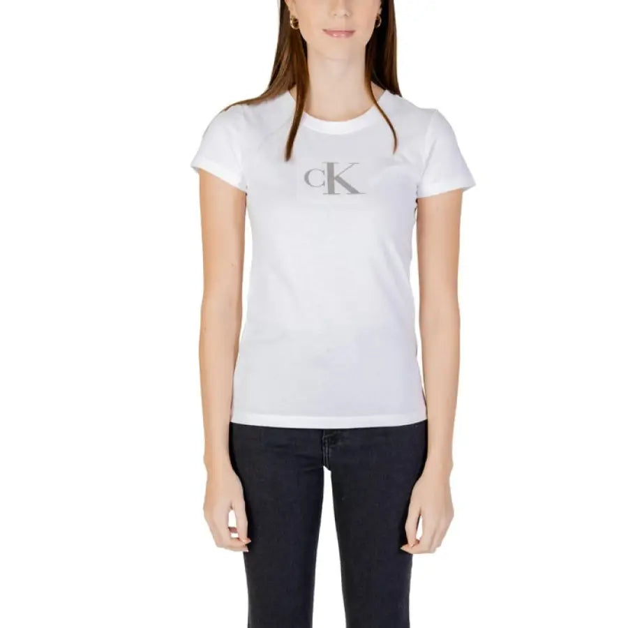 Woman in Calvin Klein Jeans white t-shirt with letter K