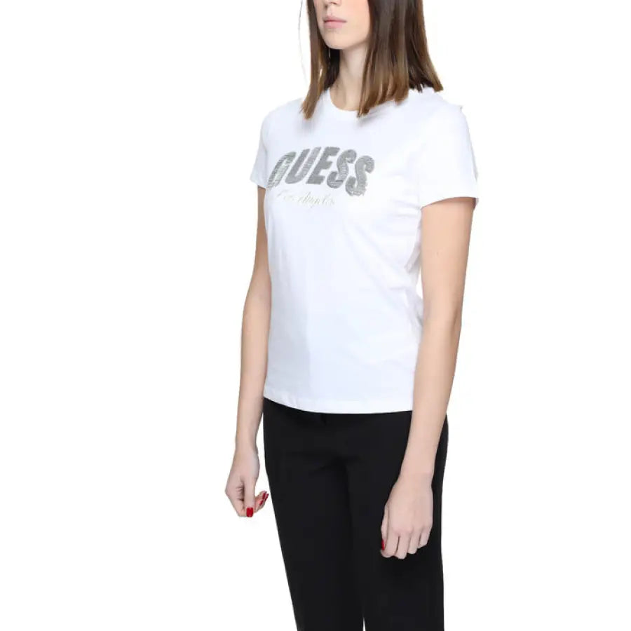 
                      
                        Woman in white ’life’ t-shirt for urban style clothing by Guess
                      
                    