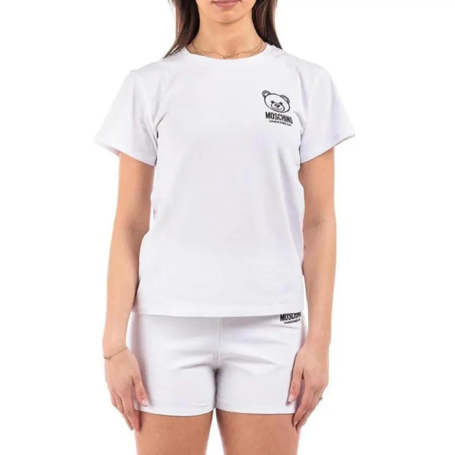 Woman in Moschino Underwear t-shirt and shorts, showcasing urban style clothing