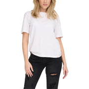 Woman wearing white T-shirt and ripped black jeans for Women’s White T-Shirt and Ripped Black Jeans