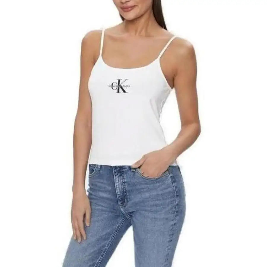 Calvin Klein woman in white tank top with black logo from Calvin Klein Jeans collection
