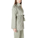 Woman wearing a belted sage green trench coat from the Women’s Belted Sage Green Trench Coat collection