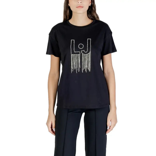 Woman wearing Liu Jo white short sleeve crew-neck T-shirt with sparkly silver LJ logo and fringe details