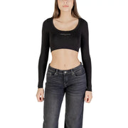 Woman wearing Tommy Hilfiger Jeans black printed long round neck crop top