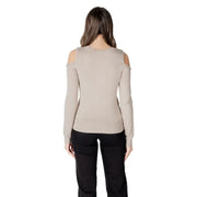 Woman wearing a cold-shoulder long-sleeve sweater from Women Cold Shoulder Sweater Collection