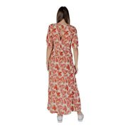 Woman in B.young Floral V-Neck Dress in Brown 100% Viscose showcasing elegant style