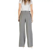 Woman wearing Liu Jo grey high-waisted wide-leg palazzo trousers with side buckle detail