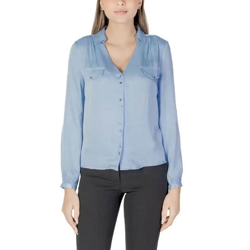 Light blue button-down shirt featured in Morgan De Toi Women’s Red V-Neck Long Shirt