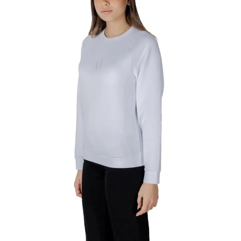 Woman wearing a light blue sweatshirt from the Women’s Light Blue Sweatshirt and Black Pants collection