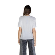 Woman wearing Karl Lagerfeld white printed round neck T shirt and grey wide-leg jeans