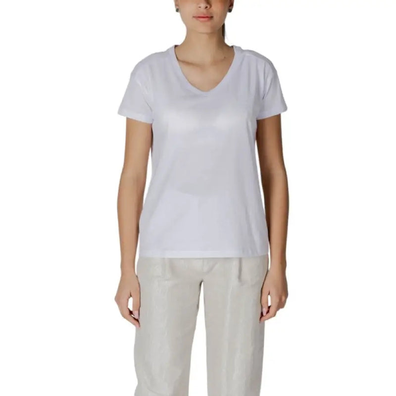Woman wearing a white V-neck T shirt featured in Womens White V Neck T Shirt product image