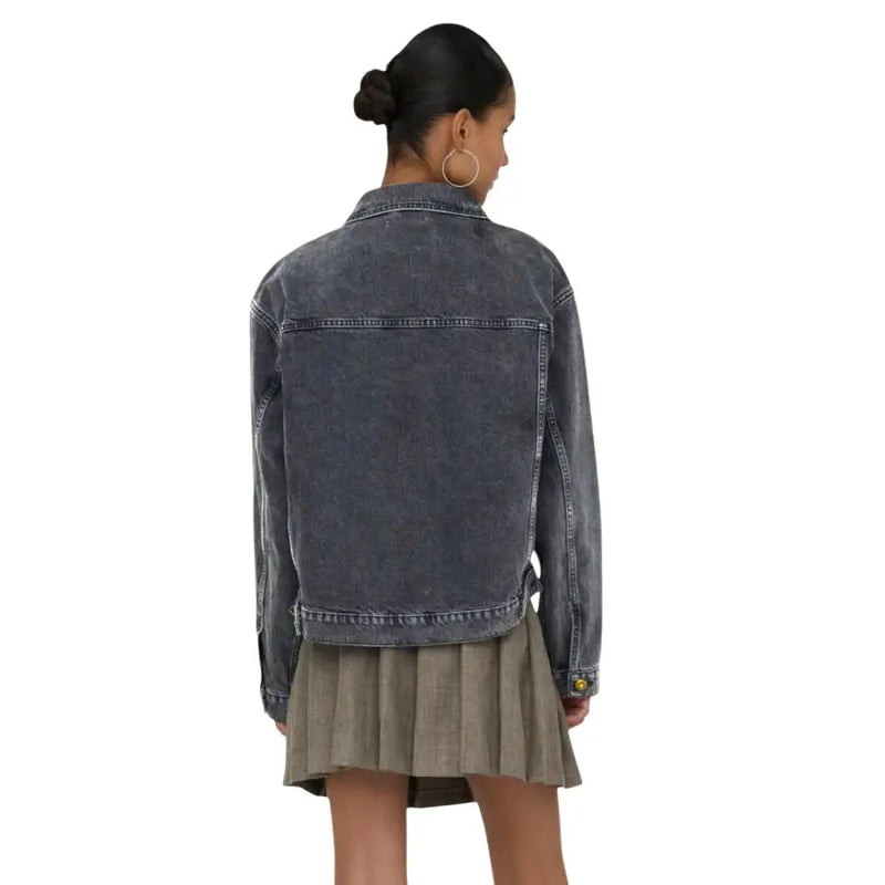 Women’s dark gray faded denim jacket with classic collar and buttoned cuffs complementing a black cotton blazer with pockets