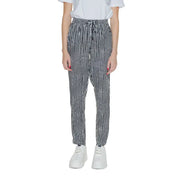 Women’s black geometric trousers with lace detail featuring high-waisted elastic drawstring waistband in black and white