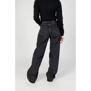 Women’s black wide leg denim jeans shown from the back with a faded wash and classic back pockets