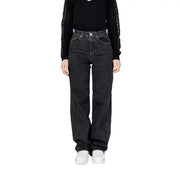 Woman wearing Women’s Black Wide Leg Jeans and black top showcasing stylish attire