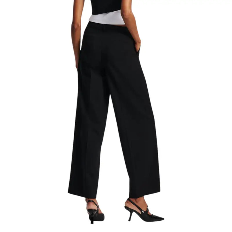 Women’s black wide-leg trousers with a white waistband from Karl Lagerfeld Fall Winter collection