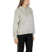 Women wearing Calvin Klein Jeans grey full-zip hooded sweatshirt with black sweatpants