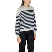 Women’s light grey and navy blue striped long-sleeve sweatshirt with distressed details and ribbed hem