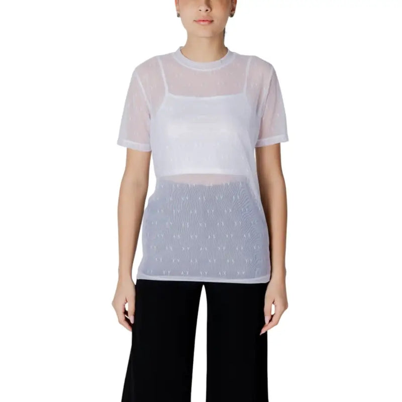 Women’s sheer white mesh top with subtle patterned lower section and short sleeves paired with white tank