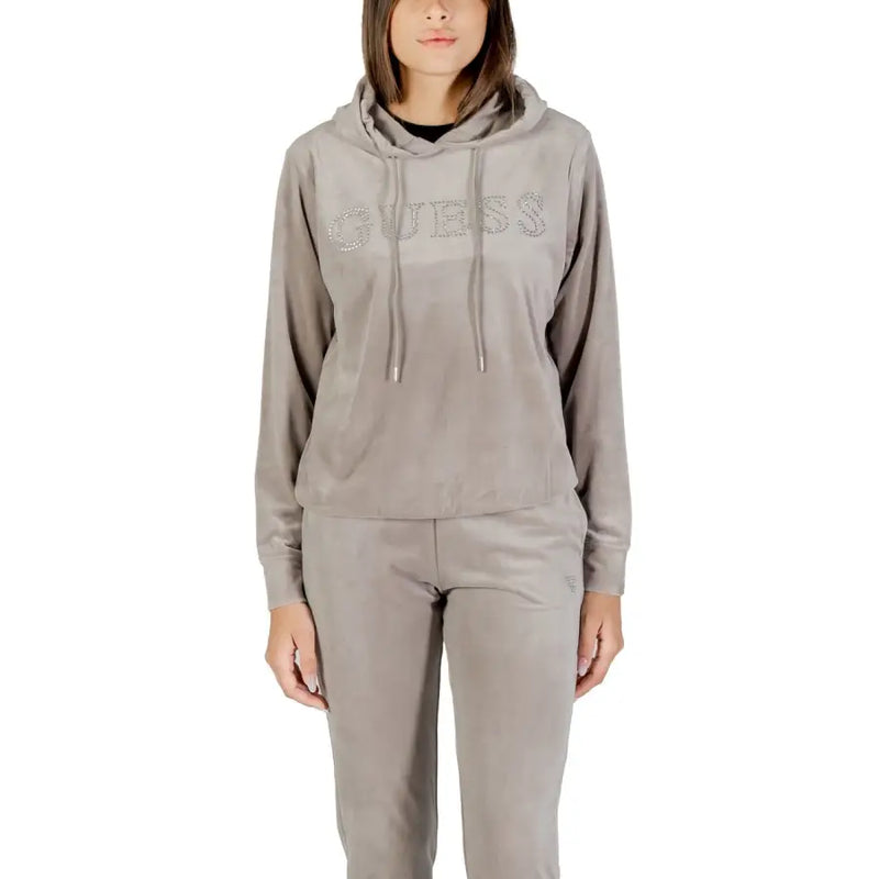 Women wearing taupe velvet tracksuit with hooded top and elasticated pants for Guess Active
