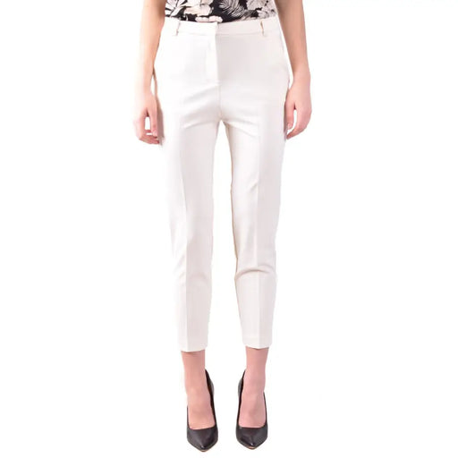 Women’s white cropped trousers with black pointed-toe heels from Pinko Spring Summer collection