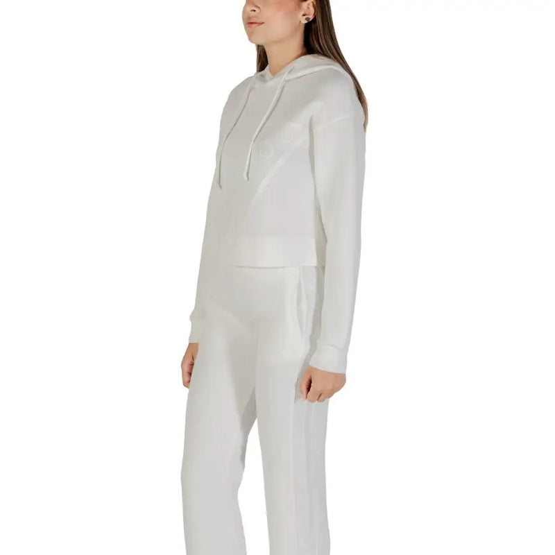 Women wearing Guess Active beige hooded round neck sweatshirt with matching sweatpants