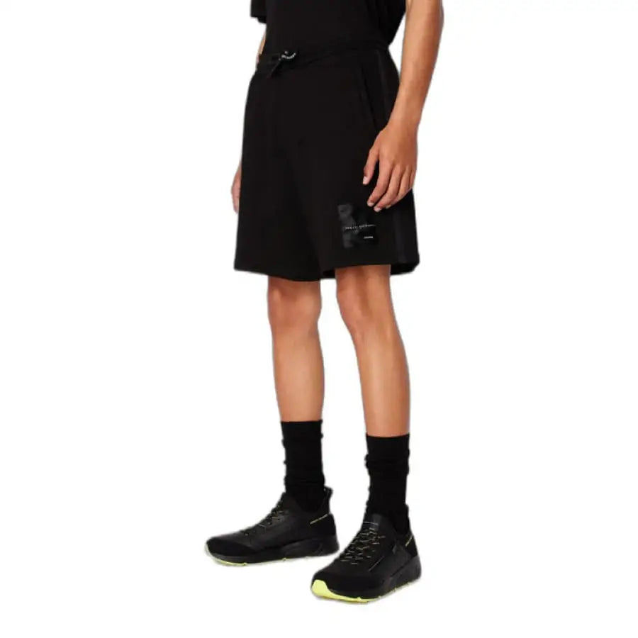 Young boy in Armani Exchange shorts, spring summer product.
