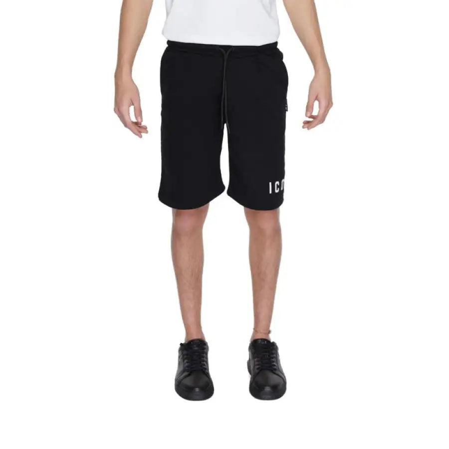 
                      
                        Young boy in urban style clothing, Icon Men Shorts, white shirt and black shorts
                      
                    